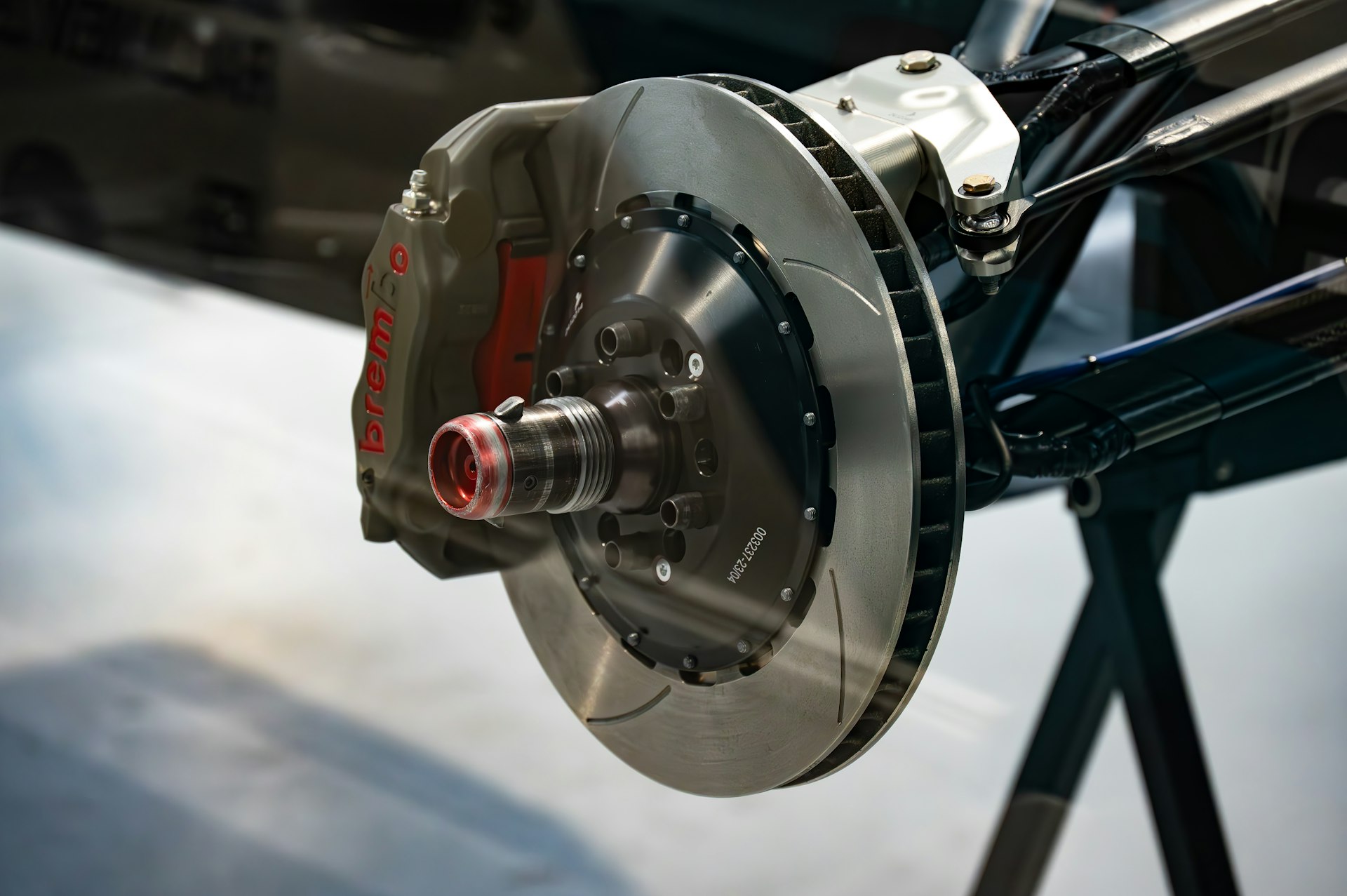 A brake rotor and caliper with the wheel removed for service